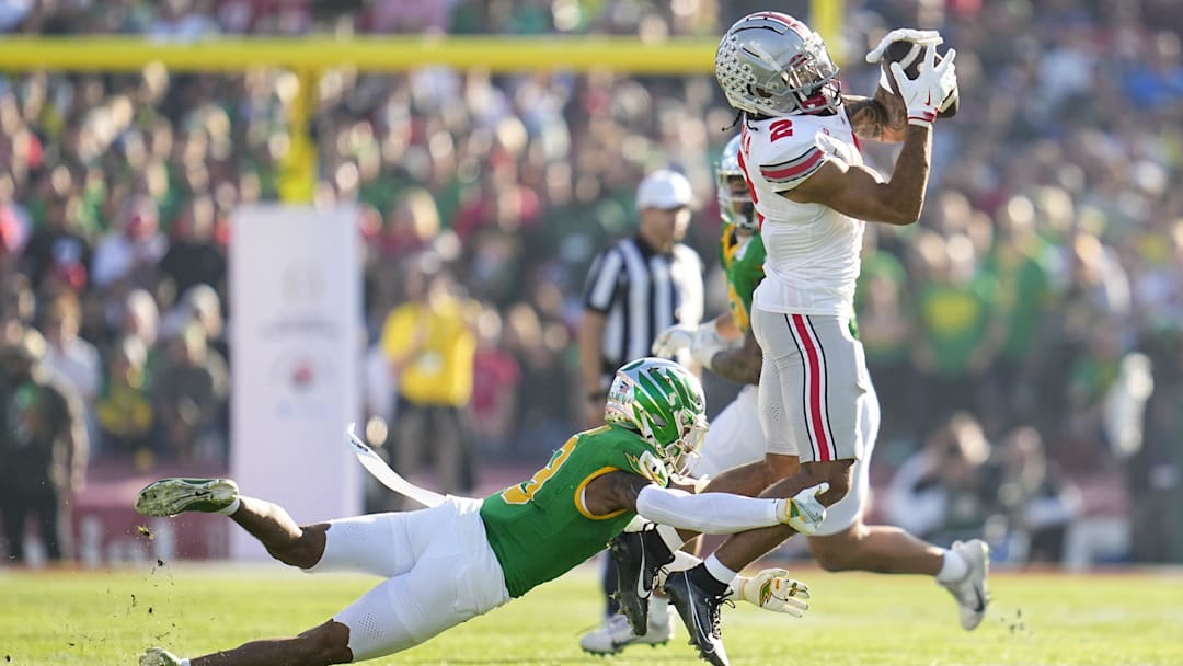 Ohio State Buckeyes wide receiver Emeka Egbuka (2) catches a pass over Oregon Ducks defensive back Nikko Reed (9) during the first half of the College Football Playoff quarterfinal at the Rose Bowl in Pasadena, Calif. on Jan. 1, 2025. Ohio State Buckeyes wide receiver Emeka Egbuka (2) catches a pass over Oregon Ducks defensive back Nikko Reed (9) during the first half of the College Football Playoff quarterfinal at the Rose Bowl in Pasadena, Calif. on Jan. 1, 2025.