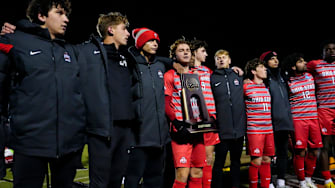 Ohio State midfielder Parker Grinstead (10) holds the trophy as they celebrate their victory over the Wake Forest Demon Deacons in the NCAA Tournament quarterfinal match at Jesse Owens Memorial Stadium on Saturday, Dec. 7, 2024 in Columbus, Ohio.