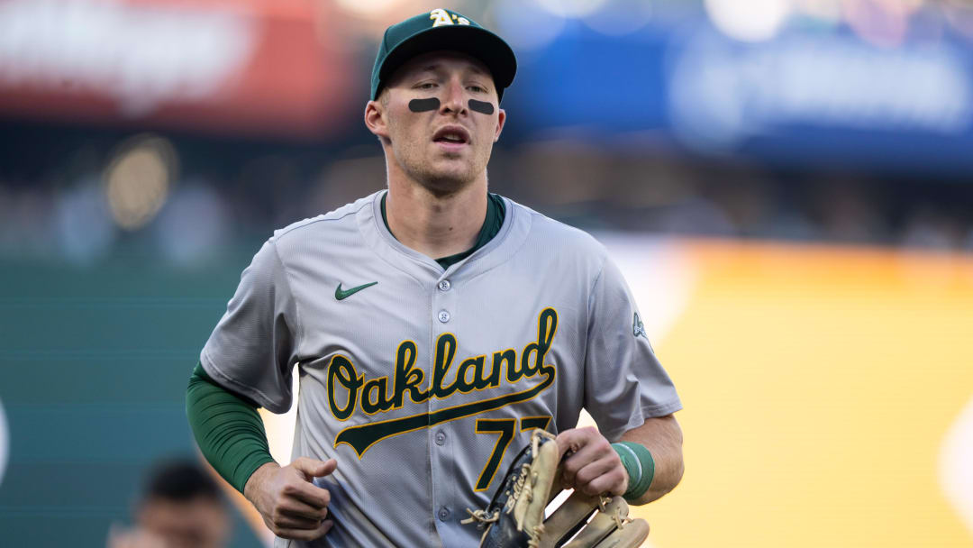 May 11, 2024; Seattle, Washington, USA;  Oakland Athletics third baseman Brett Harris (77) jogs off the field before a game against the Seattle Mariners at T-Mobile Park. Mandatory Credit: Stephen Brashear-USA TODAY Sports