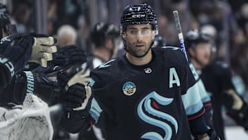 Mar 26, 2024; Seattle, Washington, USA; Seattle Kraken forward Jordan Eberle (7) is congratulated by teammates on the bench after scoring a power-play goald during the first period at Climate Pledge Arena. Mandatory Credit: Stephen Brashear-Imagn Images
