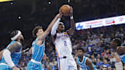 Oct 9, 2025; Oklahoma City, Oklahoma, USA; Oklahoma City Thunder guard Shai Gilgeous-Alexander (2) shoots against the Charlotte Hornets during the second quarter of a game between the Charlotte Hornets and the Oklahoma City Thunder at Paycom Center. Mandatory Credit: Alonzo Adams-Imagn Images
