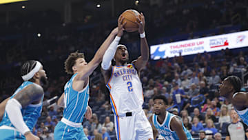 Oct 9, 2025; Oklahoma City, Oklahoma, USA; Oklahoma City Thunder guard Shai Gilgeous-Alexander (2) shoots against the Charlotte Hornets during the second quarter of a game between the Charlotte Hornets and the Oklahoma City Thunder at Paycom Center. Mandatory Credit: Alonzo Adams-Imagn Images