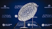 Jan 24, 2025; Columbus, OH, USA;  The AFCA Coaches' Trophy sits on display at the Ohio Union on Ohio State University's campus. The Buckeyes football team will be presented with the trophy on Sunday as winners of the USA TODAY Sports and the American Football Coaches Association 2024 US LBM Coaches Poll. Mandatory Credit: Adam Cairns-USA TODAY Network via Imagn Images