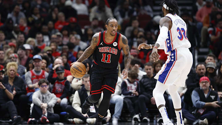 Dec 30, 2023; Chicago, Illinois, USA; Chicago Bulls forward DeMar DeRozan (11) brings the ball up court against the Philadelphia 76ers during the first half at United Center. Mandatory Credit: Kamil Krzaczynski-Imagn Images