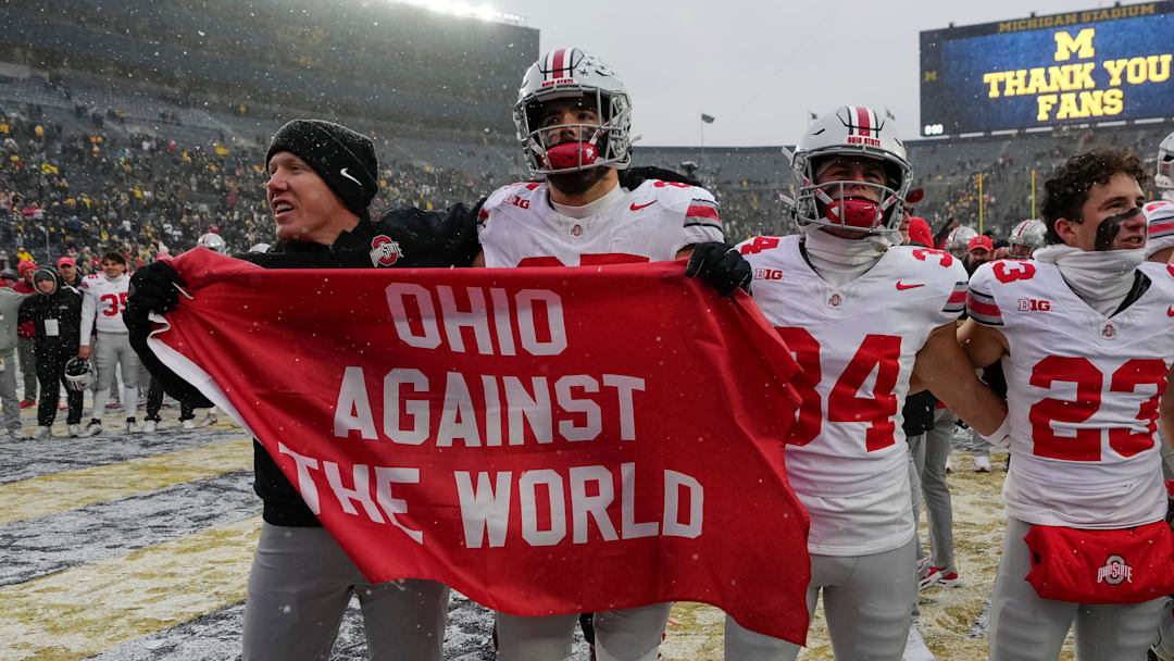 Ohio State Buckeyes tight ends coach Keenan Bailey celebrates with tight end Bennett Christian (85), wide receiver Brennen Schramm (34) and wide receiver Nolan Baudo (23) following the NCAA football game against the Michigan Wolverines at Michigan Stadium in Ann Arbor, Mich. on Nov. 29, 2025. Ohio State won 27-9.