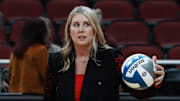 Louisville head coach Dani Busboom Kelly helps her team warm up ahead of their Final Four match against Pittsburgh at the KFC Yum! Center in Louisville, Ky. on Dec. 19, 2024.