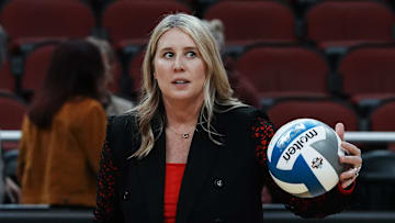 Louisville head coach Dani Busboom Kelly helps her team warm up ahead of their Final Four match against Pittsburgh at the KFC Yum! Center in Louisville, Ky. on Dec. 19, 2024.
