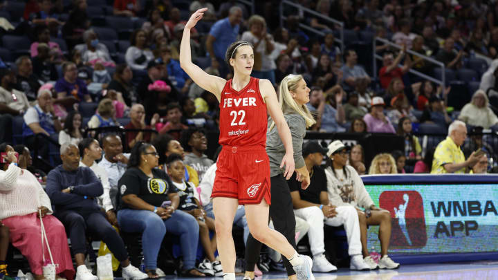 Indiana Fever guard Caitlin Clark (22) reacts as she walks off the floor during the second half of a basketball game