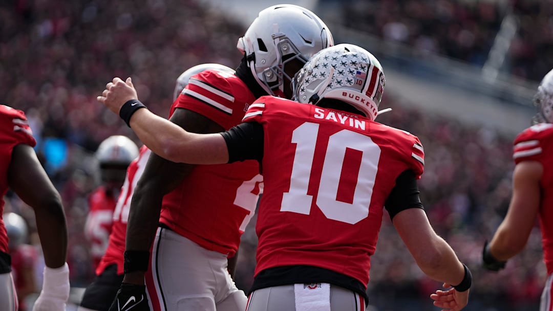 Ohio State Buckeyes wide receiver Jeremiah Smith (4) celebrates a touchdown with quarterback Julian Sayin (10) during the NCAA football game against the Penn State Nittany Lions at Ohio Stadium in Columbus on Nov. 1, 2025.