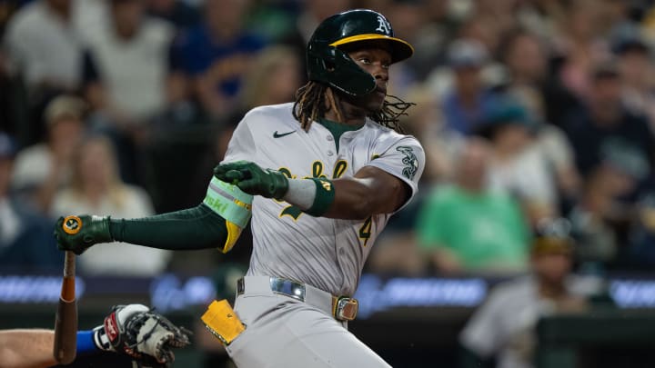 May 10, 2024; Seattle, Washington, USA; Oakland Athletics right fielder Lawrence Butler (4) takes a swing during an at-bat against the Seattle Mariners at T-Mobile Park. Mandatory Credit: Stephen Brashear-USA TODAY Sports