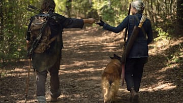 Norman Reedus as Daryl Dixon, Melissa McBride as Carol Peletier - The Walking Dead _ Season 10, Episode 21 - Photo Credit: Eli Ade/AMC