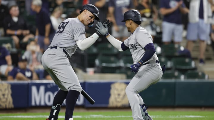 Aug 13, 2024; Chicago, Illinois, USA; New York Yankees outfielder Juan Soto (22) celebrates with outfielder Aaron Judge (99) after hitting a solo home run against the Chicago White Sox during the seventh inning at Guaranteed Rate Field. Mandatory Credit: Kamil Krzaczynski-USA TODAY Sports