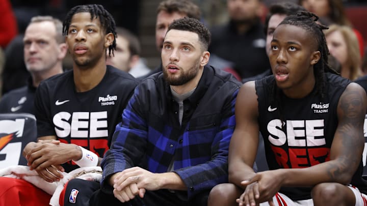 Dec 23, 2023; Chicago, Illinois, USA; Injured Chicago Bulls guard Zach LaVine (8) looks on from the bench during the second half of a basketball game against the Cleveland Cavaliers at United Center. Mandatory Credit: Kamil Krzaczynski-Imagn Images