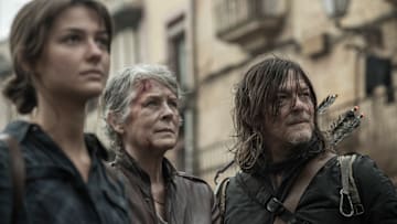 Melissa McBride as Carol Peletier, Norman Reedus as Daryl Dixon, and Candela Saitta as Justina in The Walking Dead: Daryl Dixon season 3