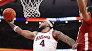 Nov 19, 2025; Chicago, Illinois, USA; Illinois Fighting Illini guard Kylan Boswell (4) goes to the basket against Alabama Crimson Tide during the first half at United Center. Mandatory Credit: Kamil Krzaczynski-Imagn Images