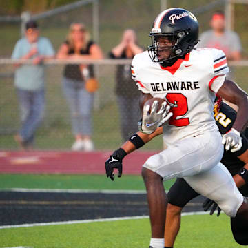 Sep 13, 2024; Sunbury, Ohio, USA; Delaware Hayes Favour Akih (2) runs the ball in for a touchdown against Big Walnut in the first half at Big Walnut High School.