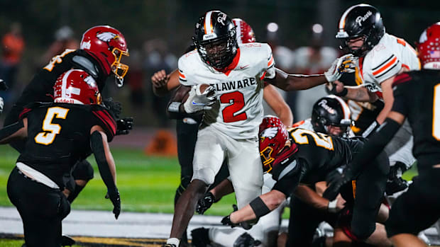 Sep 13, 2024; Sunbury, Ohio, USA; Delaware Hayes Favour Akih (2) runs the ball against Big Walnut in the second half at Big W