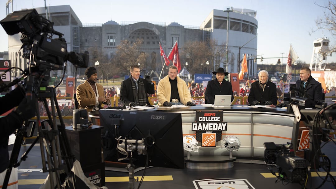 ESPN cast, from left, Desmond Howard, Rece Davis, Pat McAfee, Nick Saban, Lee Corso and Kirk Herbstreit sit on the set of College GameDay prior to the College Football Playoff first round game between the Ohio State Buckeyes and Tennessee Volunteers in Columbus on Dec. 21, 2024.