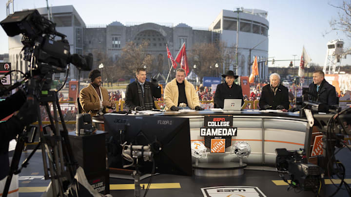 ESPN cast, from left, Desmond Howard, Rece Davis, Pat McAfee, Nick Saban, Lee Corso and Kirk Herbstreit sit on the set of College GameDay prior to the College Football Playoff first round game between the Ohio State Buckeyes and Tennessee Volunteers in Columbus on Dec. 21, 2024.