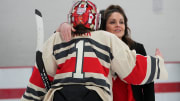 Feb 17, 2024; Columbus, Ohio, USA; Ohio State head coach Nadine Muzerall hugs goaltender Raygan Kirk