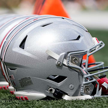 Sep 2, 2023; Bloomington, Indiana, USA; Ohio State Buckeyes helmets sit on the sideline prior to the NCAA football game at Indiana University Memorial Stadium. Ohio State won 23-3.