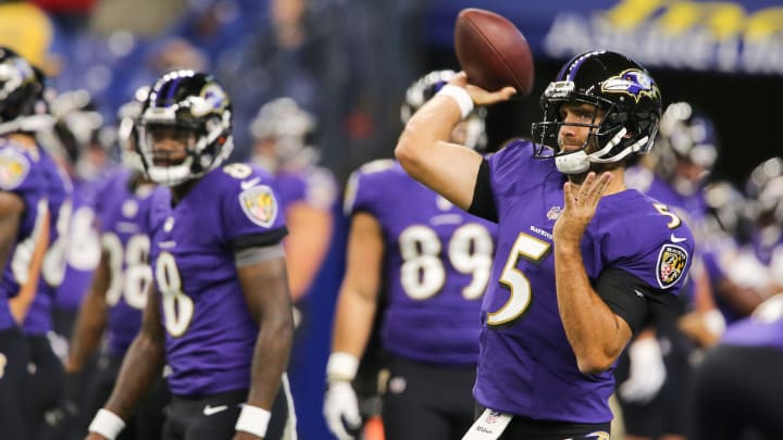 The Baltimore Ravens         Lamar Jackson (8) looked on as teammate Joe Flacco (5) warmed up before their preseason game against the Indianapolis Colts at Lucas Oil Stadium in Indianapolis.Aug. 20, 2018