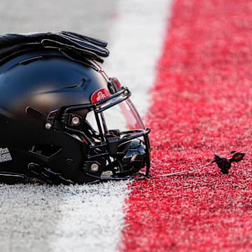 Sep 24, 2022; Columbus, Ohio, USA; A black helmet sits on the sideline as part of the special uniform the Ohio State Buckeyes will wear in the NCAA Division I football game against the Wisconsin Badgers at Ohio Stadium. Mandatory Credit: Adam Cairns-The Columbus Dispatch

Ncaa Football Wisconsin Badgers At Ohio State Buckeyes