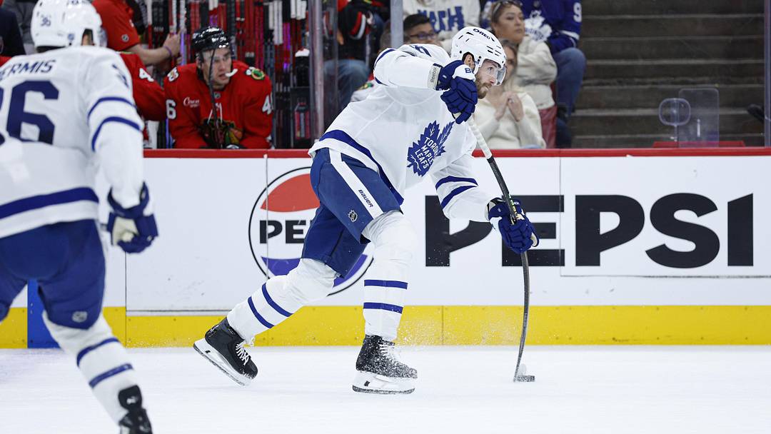 Nov 15, 2025; Chicago, Illinois, USA; Toronto Maple Leafs defenseman Oliver Ekman-Larsson (95) shoots against the Chicago Blackhawks during the first period at United Center. Mandatory Credit: Kamil Krzaczynski-Imagn Images
