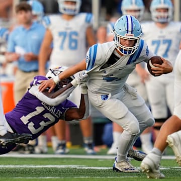 St. Francis DeSales running back tackles Olentangy Berlin quarterback during Week 1 of high school football at DeSales High School on Aug. 22, 2025.
