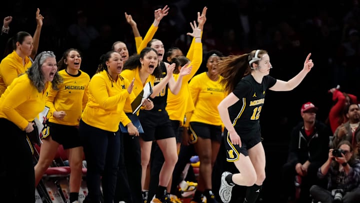 The Michigan Wolverines bench reacts to a shot from guard Syla Swords (12) during the NCAA women's basketball game against the Ohio State Buckeyes at the Jerome Schottenstein Center on Feb. 25, 2026. Ohio State lost 88-86 in overtime.