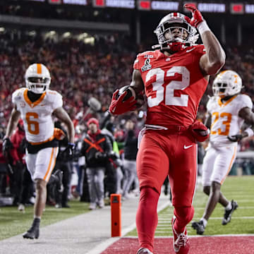 Ohio State Buckeyes running back TreVeyon Henderson (32) runs for a touchdown during the first half of the College Football Playoff first round game against the Tennessee Volunteers at Ohio Stadium in Columbus on Dec. 21, 2024.