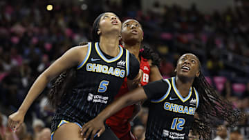 Aug 30, 2024; Chicago, Illinois, USA; Chicago Sky forward Angel Reese (5) and forward Michaela Onyenwere (12) defend against Indiana Fever forward Aliyah Boston (7) during the first half at Wintrust Arena. Mandatory Credit: Kamil Krzaczynski-Imagn Images
