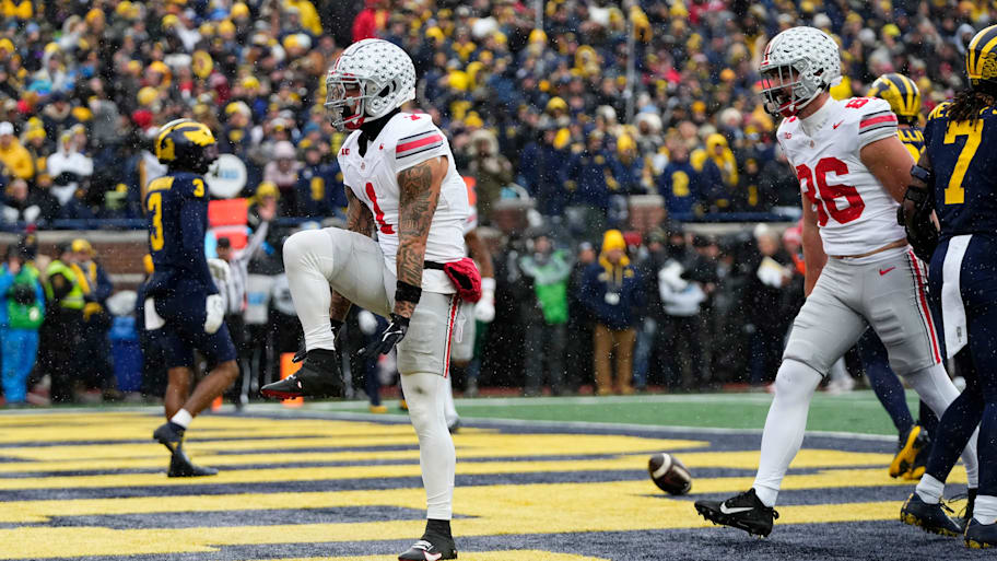 Brandon Inniss celebrates a touchdown for the Ohio State Buckeyes at the Michigan Wolverines.