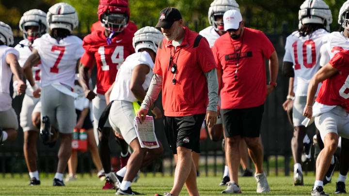 Aug 1, 2024; Columbus, OH, USA; Ohio State Buckeyes defensive coordinator Jim Knowles walks across the field during football camp at the Woody Hayes Athletic Complex.