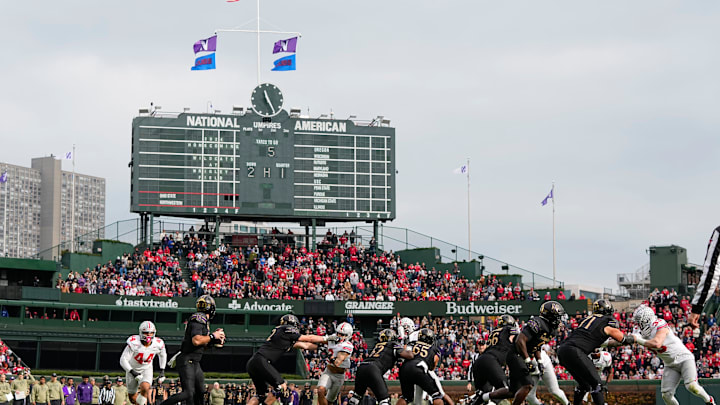Northwestern Wildcats quarterback Jack Lausch during an NCAA football game against the Ohio State Buckeyes at Wrigley Field Northwestern Wildcats quarterback Jack Lausch during an NCAA football game against the Ohio State Buckeyes at Wrigley Field