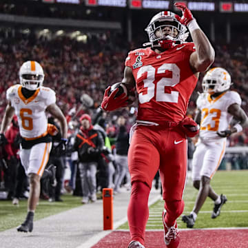 Ohio State Buckeyes running back TreVeyon Henderson (32) runs for a touchdown during the first half of the College Football Playoff first round game against the Tennessee Volunteers at Ohio Stadium in Columbus on Dec. 21, 2024.