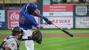Iowa Cubs right fielder Alexander Canario connects on a pitch against St. Paul for a base hit during