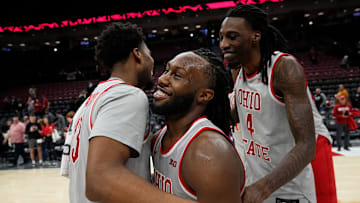 Ohio State Buckeyes forward Sean Stewart (13), guard Bruce Thornton (2) and forward Aaron Bradshaw (4) celebrate following the second overtime of the NCAA men's basketball game against the Nebraska Cornhuskers at Value City Arena in Columbus on March 4, 2025. Ohio State won 116-114.