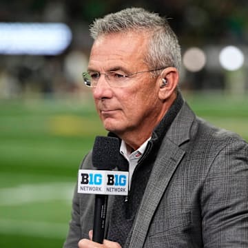 Former Ohio State Buckeyes head coach Urban Meyer broadcasts for the Big Ten Network prior to the College Football Playoff National Championship against the Notre Dame Fighting Irish at Mercedes-Benz Stadium in Atlanta on Jan. 20, 2025.