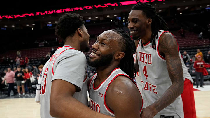 Ohio State Buckeyes forward Sean Stewart (13), guard Bruce Thornton (2) and forward Aaron Bradshaw (4) celebrate following the second overtime of the NCAA men's basketball game against the Nebraska Cornhuskers at Value City Arena in Columbus on March 4, 2025. Ohio State won 116-114.