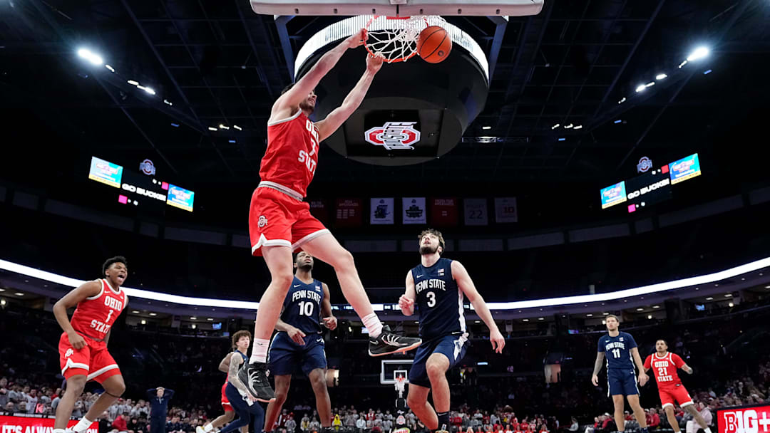 Ohio State Buckeyes center Ivan Njegovan (7) dunks over Penn State Nittany Lions forward Ivan Juric (3) during the second half of the NCAA men's basketball game at the Schottenstein Center in Columbus on Jan. 26, 2026. Ohio State won 84-78.