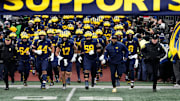 Michigan Wolverines head coach Sherrone Moore leads his team onto the field for the NCAA football game against the Ohio State Buckeyes at Michigan Stadium in Ann Arbor, Mich. on Nov. 29, 2025. Ohio State won 27-9.