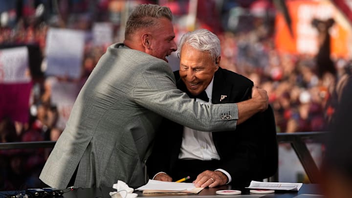 Pat McAfee hugs Lee Corso on the set of ESPN College GameDay prior to the NCAA football game between the Ohio State Buckeyes and the Texas Longhorns at Ohio Stadium on Aug. 30, 2025.