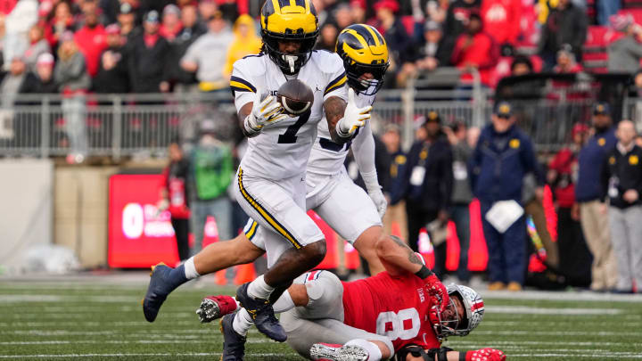 Nov 26, 2022; Columbus, Ohio, USA;  Michigan Wolverines defensive back Makari Paige (7) makes an interception on a pass intended for Ohio State Buckeyes tight end Cade Stover (8) during the second half of the NCAA football game at Ohio Stadium. Ohio State lost 45-23. Mandatory Credit: Adam Cairns-The Columbus Dispatch

Ncaa Football Michigan Wolverines At Ohio State Buckeyes