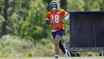 Besides passing the ball at his first Bears training camp practice, quarterback Caleb Williams also was catching it.