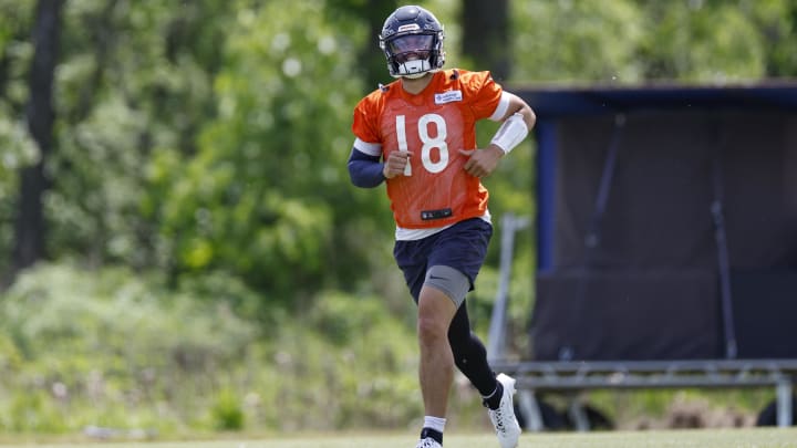 Besides passing the ball at his first Bears training camp practice, quarterback Caleb Williams also was catching it.