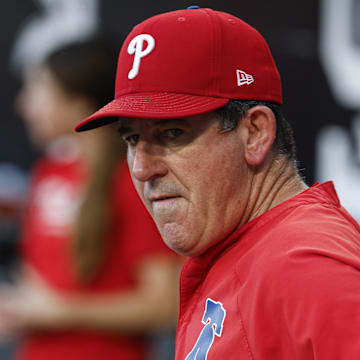 Jul 28, 2025; Chicago, Illinois, USA; Philadelphia Phillies manager Rob Thomson (59) looks on from the dugout before a baseball game against the Chicago White Sox at Rate Field.