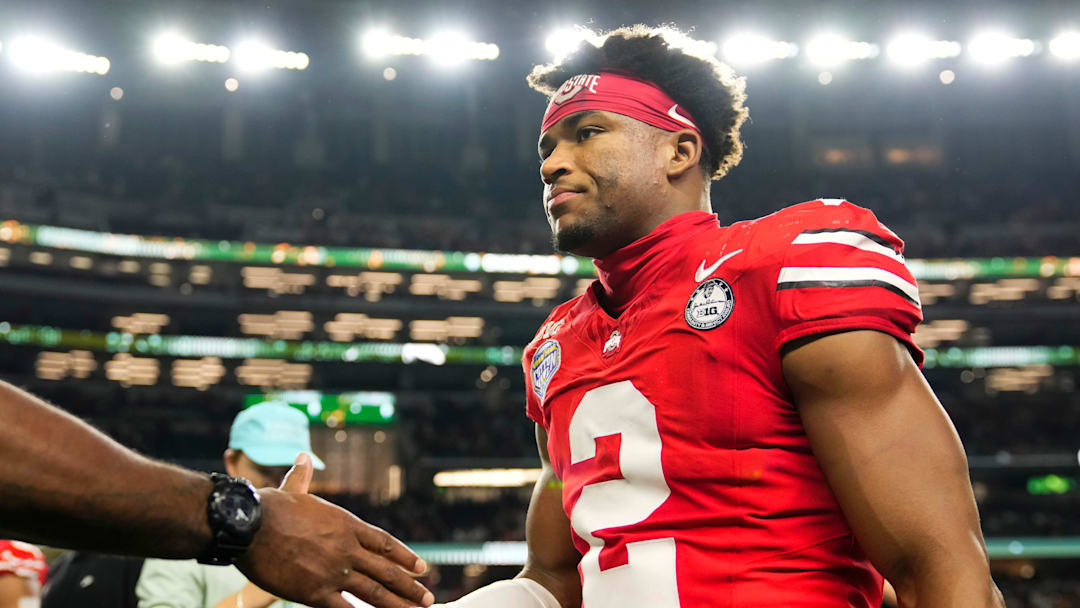 Ohio State Buckeyes defensive back Caleb Downs (2) leaves the field following the Cotton Bowl at AT&T Stadium in Arlington, Texas for the College Football Playoff quarterfinal game against the Miami Hurricanes on Dec. 31, 2025. Ohio State lost 24-14. Ohio State Buckeyes defensive back Caleb Downs (2) leaves the field following the Cotton Bowl at AT&T Stadium in Arlington, Texas for the College Football Playoff quarterfinal game against the Miami Hurricanes on Dec. 31, 2025. Ohio State lost 24-14.