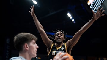 Missouri guard Aidan Shaw (23) guards the inbounds pass of Florida forward Thomas Haugh (10) during the first half of their quarterfinal game of the SEC Men's Basketball Tournament at Bridgestone Arena in Nashville, Tenn., Friday, March 14, 2025.