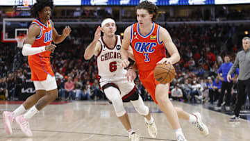 Jan 13, 2023; Chicago, Illinois, USA; Oklahoma City Thunder guard Josh Giddey (3) drives to the basket against Chicago Bulls guard Alex Caruso (6) during the second half at United Center. Mandatory Credit: Kamil Krzaczynski-Imagn Images